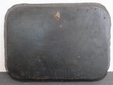 a piece of luggage sitting on a table next to a wall