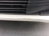 a close up of a car ' s front bumper and grille