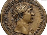 a close up of a gold coin with a woman ' s head on it