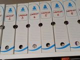 a lot of boxes that are lined up on a shelf