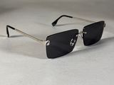 sunglasses with metal arms and black lenses on a white surface