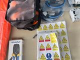 the contents of a backpack are laid out on a table