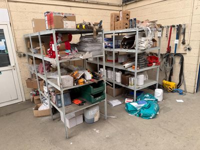 a garage with a lot of tools and supplies on the shelves