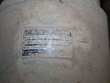 a close up of a white vase with a label on it