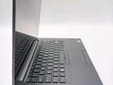 a laptop with a black keyboard on a white surface