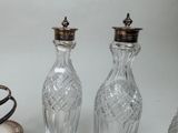 three glass vases sitting next to each other on a table