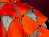 a mannequin with orange ribbons on a mannequin