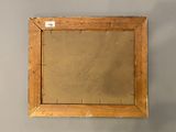 an image of a picture of a wooden frame with a label on it