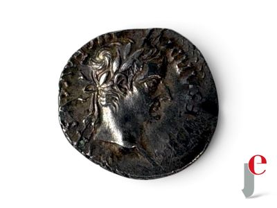 une image d'une pièce de monnaie sur laquelle figure le visage d'une femme