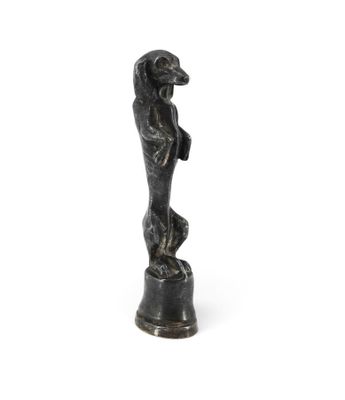 statue of a woman standing on a pedestal with her hands on her hips