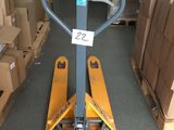 a fork lifter that is sitting in the middle of a room