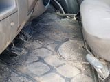 a dirty seat in the back of a truck