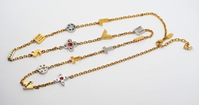 a close up of three different bracelets on a white surface