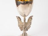 a silver goblet with a bird on it