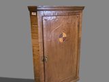 a wooden cabinet with a door on the top of it