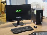 a desktop computer sitting on a desk with a keyboard and mouse