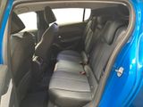 the back seats of a blue car with a black seat belt