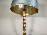 a lamp that has a blue shade on it