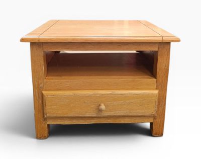 an image of a small wooden table with drawers