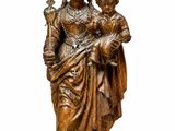 an image of a statue of a woman holding a child