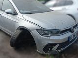 a silver car that is parked on the side of the road