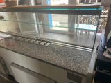 an image of a counter with a glass display case on it