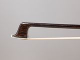a close up of a violin bow with a wooden handle