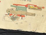 an old book with a drawing of a gun on it