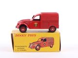a red toy truck sitting on top of a yellow box