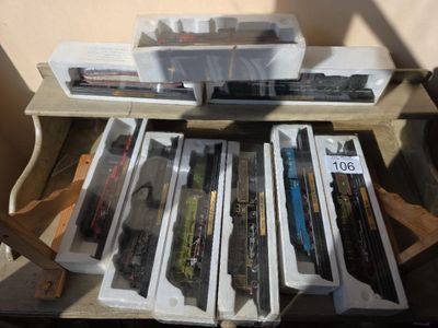a lot of toy trains sitting on a table