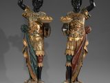 pair of bronze statues of a roman soldier and a roman woman