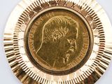 a gold plate with a picture of a man on it