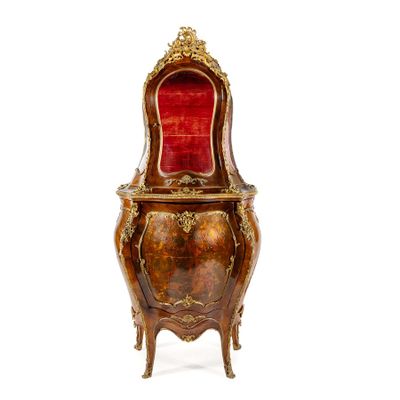 a small wooden chair with a red velvet seat