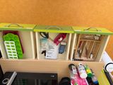 a desk with a laptop and other office supplies on it
