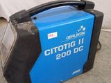 a blue and black machine that is sitting on the ground