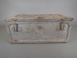 an old metal box that is sitting on a table