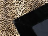 leopard print fabric with a black border on a white background