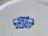 a white plate with a blue and white design on it