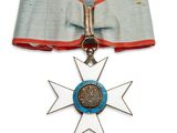 une image représentant une médaille ornée d'un ruban bleu et d'une étoile