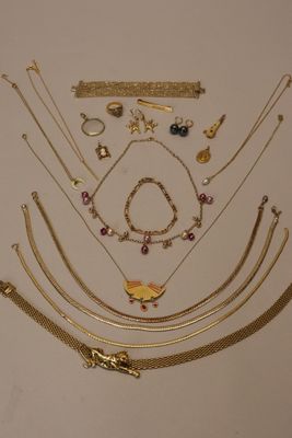 a lot of gold necklaces and bracelets on the table