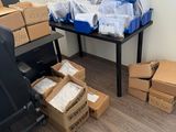 a desk with boxes and a chair in a room