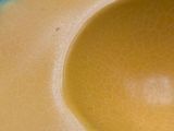 a close up of a yellow melon with a hole in it