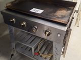 an image of a gas grill in a kitchen