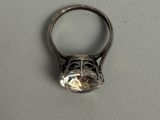 a silver ring with a diamond on it