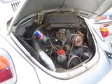 a small engine in the back of a white car