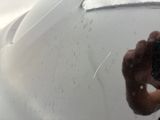 a man taking a picture of himself in the mirror of a car