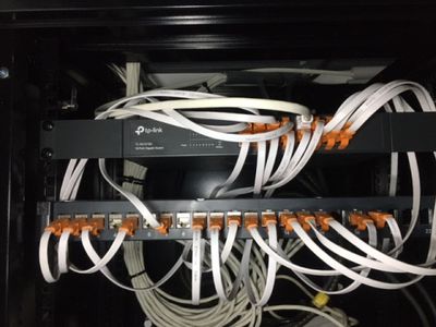a bunch of wires that are connected to a cabinet