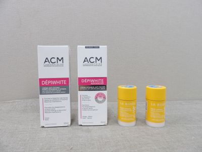 deux flacons d'Acm Dernimate et une boîte de déodorant