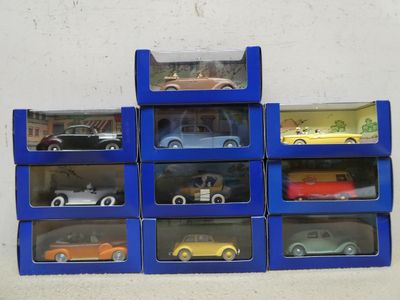 many different cars in the blue boxes on the wall