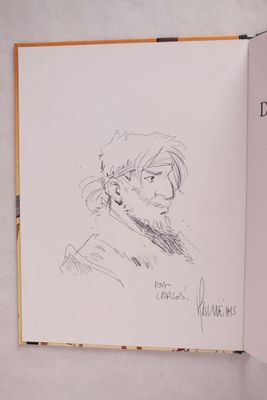 un livre ouvert sur lequel est dessiné le visage d'un homme